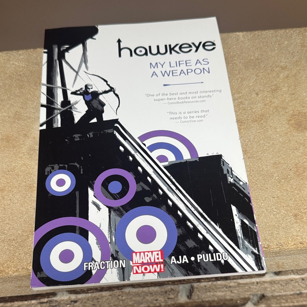 Marvel Hawkeye Graphic Novel with Black, White, and Purple Art